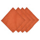 Four orange linen napkins from the Juliska Berry Scallop Napkin & Tablecloth Collection, each featuring stitched edges and elegantly fanned out against a white background—an ideal complement to your Juliska linens.