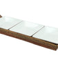 The Calaisio Condiment Tray Collection features a rectangular woven tray with a handle that holds three square porcelain whiteware bowls in a row.