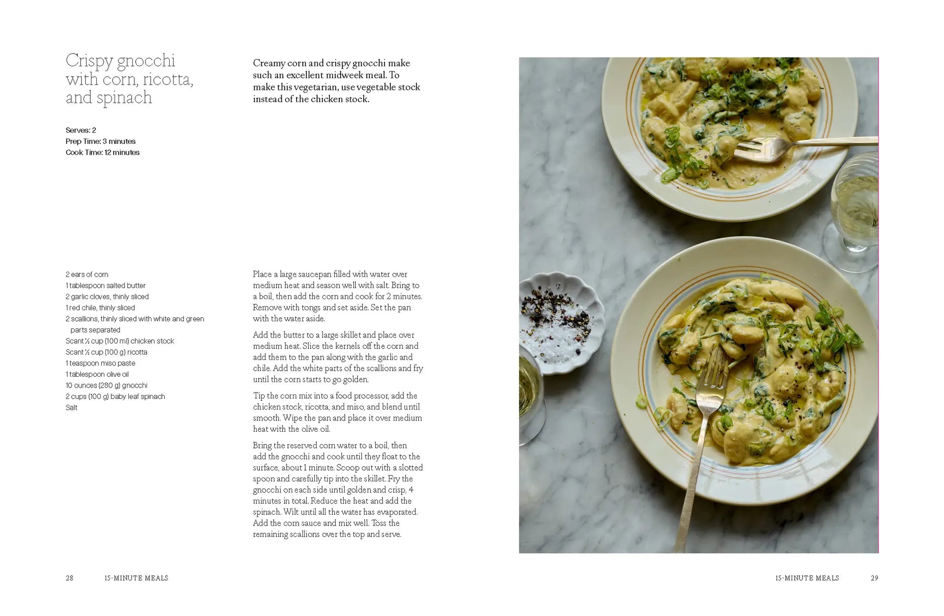 Two plates of crispy gnocchi with corn, ricotta, and spinach—garnished with herbs—sit atop a white table, accompanied by a small bowl of pepper and a glass of water; the perfect setting inspired by “A Meal For Two” from Chronicle Books.