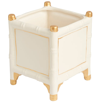 The Bamboo Cachepot Collection by Abigails features a white ceramic square cachepot with gold accents at the corners and feet, adorned with a textured bamboo pattern. Made in Portugal.