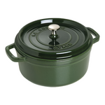 A dark green Staub Cast Iron Dutch Oven from the Staub Cast Iron Dutch Oven Collection, featuring a lid with a metal knob and inscriptions of "La Cocotte" and "Staub", along with handles on both sides.