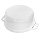 The Staub Cast Iron Dutch Oven Collection from the brand Staub features a white, round ceramic dish displayed upside down, resembling a classic Dutch oven, with two side handles and embossed details on the bottom.
