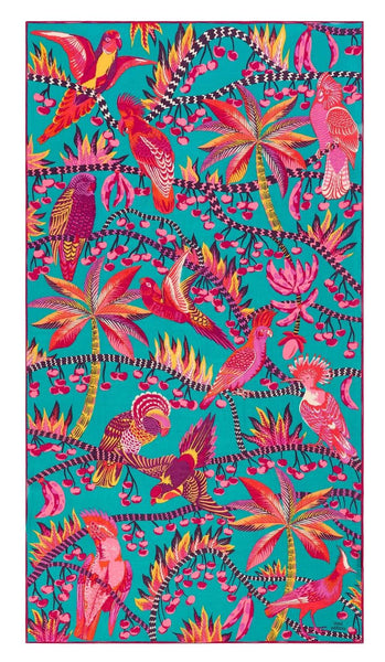 A vibrant illustration features exotic birds in various colors perched on stylized tropical plants against a bright turquoise background, beautifully printed on 100% cotton Inoui Editions Cerise Scarf made in India by Inoui Editions.