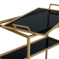 Arteriors Jak Bar Cart in antique brass, featuring two tiers with removable black glass trays.