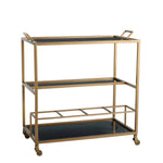 Arteriors Jak Bar Cart in antique brass featuring three tiers, two handles, removable black glass trays, and casters.
