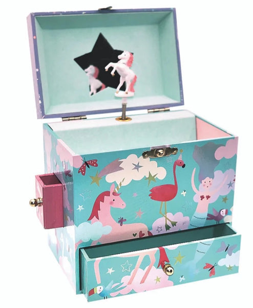A Floss and Rock Rainbow Woodland Jewelry Box with an open compartment, revealing a spinning unicorn figure and decorated with whimsical illustrations of unicorns, clouds, and stars.