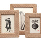 Three Pigeon and Poodle Genova Frame Collection each containing a black and white illustration; from left to right, a man with a camera, a harp, and a decorative bomb.