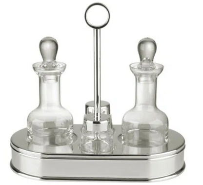 The St. James 5 Piece Oval Cruet Set includes two crystal containers with stoppers, displayed on a silver-plated tray stand with a central handle for elegant separation.