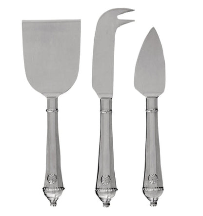 The Juliska Berry & Thread Polished Cheese Knife Set features three stainless steel knives—flat spatula, fork-tipped knife, and pointed spreader—each with ornate handles, perfect for elevating any cheese lover’s collection.