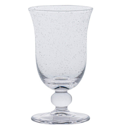 The Juliska Provence Basil Drinkware Collection features a textured glass goblet with a flared rim, round base, and decorative stem, inspired by Provence glasses and shown on a white background.