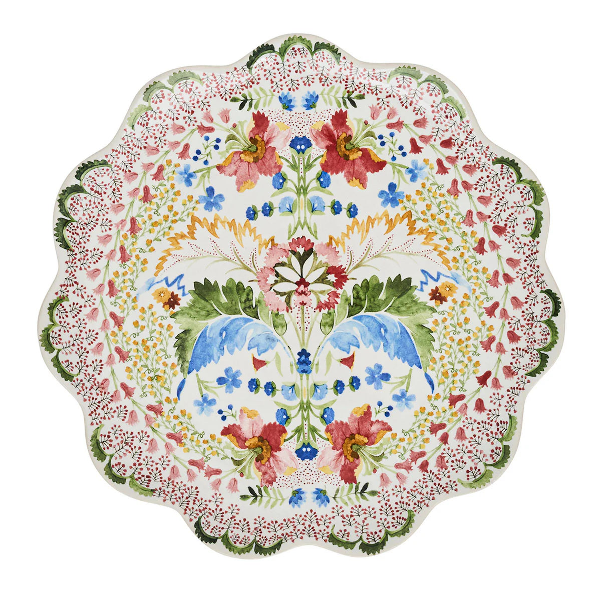 The Sofia Serveware Collection by Juliska features scalloped ceramic plates with ruffled edges and intricate colorful fantasy floral motifs on a white background.