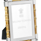 The Bamboo Classic Frame Collection by William Yeoward Crystal features a rectangular bamboo frame with nickel-plated silver and gold borders, holding a branded placeholder card—an elegant addition to your home décor.