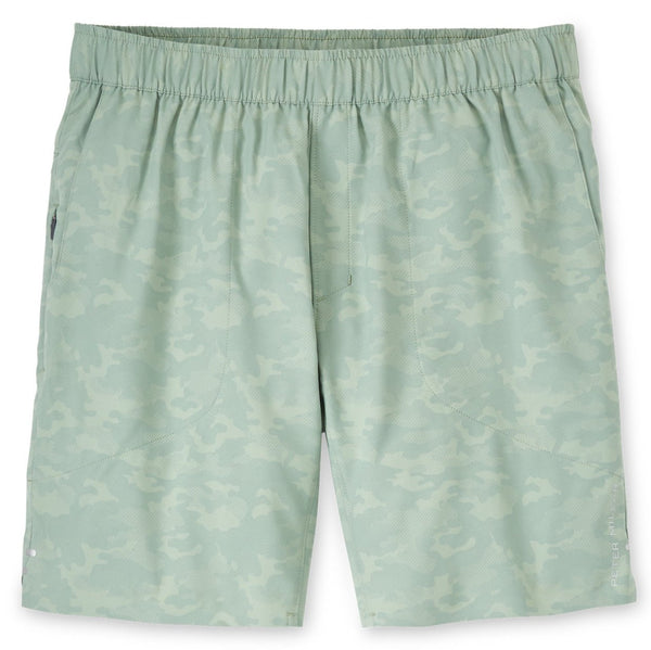 A Peter Millar men's short with a green camouflage print that is water-resistant.