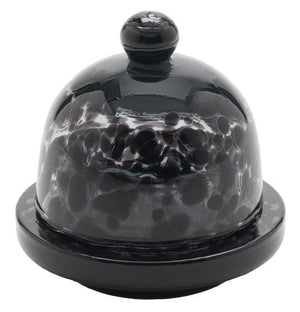 The Andrew Leopard Butter Dish by Blue Pheasant features a black and white speckled hand-blown glass dome with a round knob, set on a matching base—ideal for anyone seeking a unique, round butter dish.