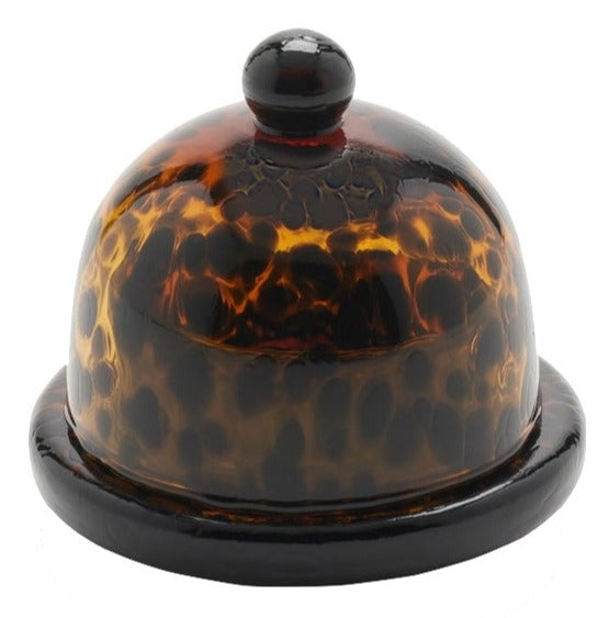 A round, amber-tortoiseshell patterned Blue Pheasant Andrew butter dish with a dome-shaped lid and a small knob on top, isolated on a white background.