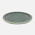 The Langston Bar Collection serving tray by Blue Pheasant features a round, flat green design with a raised edge and subtle light trim—perfect for organizing bar essentials or pairing with an ice bucket—shown on a plain white background.