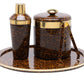 The Maximilian Bar Collection by Blue Pheasant features a brown and gold faux tortoise shell pattern with a cocktail shaker, ice bucket with lid, tongs, and round tray.