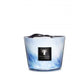 A decorative scented candle in a glass jar with a blue and white marbled design, featuring an amber aroma and carrying the label "Baobab Collection," is known as the Baobab Collection Eden Seaside Candle from the brand Baobab.