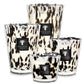 Four decorative Baobab Collection Pearls Black Candles with varying sizes, featuring a leopard print design on hand-blown glass containers.