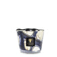 A scented Baobab Collection Stones Lazuli Candle in a decorative glass holder with a marbled blue and white design reminiscent of Lazuli Stones.