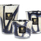 Three Baobab Collection Stones Lazuli Candles, featuring marbled white and blue glass containers in different sizes inspired by Lazuli Stones.