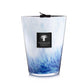 A tall, decorative scented candle featuring a blue and white gradient design. The label reads "Baobab Collection Eden Seaside Candle," evoking the rich warmth of amber intertwined with hints of vetiver.