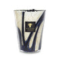 A Baobab Collection Stones Lazuli Candle from Baobab showcasing a brown and blue marbled glass design infused with sea salt and musk.