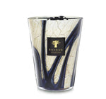 A Baobab Collection Stones Lazuli Candle from Baobab showcasing a brown and blue marbled glass design infused with sea salt and musk.