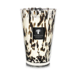Decorative Baobab Collection Pearls Black Candle in a hand-blown glass holder with a tortoiseshell pattern and the label "Baobab Collection.
