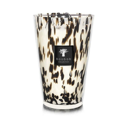 Decorative Baobab Collection Pearls Black Candle in a hand-blown glass holder with a tortoiseshell pattern and the label "Baobab Collection.