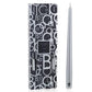 A silver tapered candle is displayed next to its box, adorned with a black and white letter pattern design, ready to elegantly complement any candlestick from the Baobab Collection Candela by Baobab.