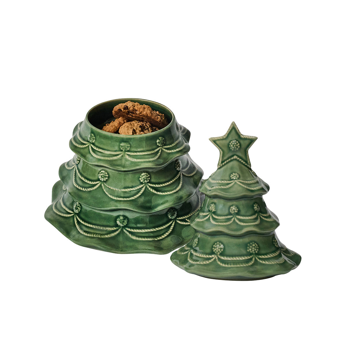 The Juliska Berry & Thread Basil Christmas Tree Cookie Jar is a handcrafted ceramic jar shaped like a festive tree, with a removable lid to reveal cookies inside.