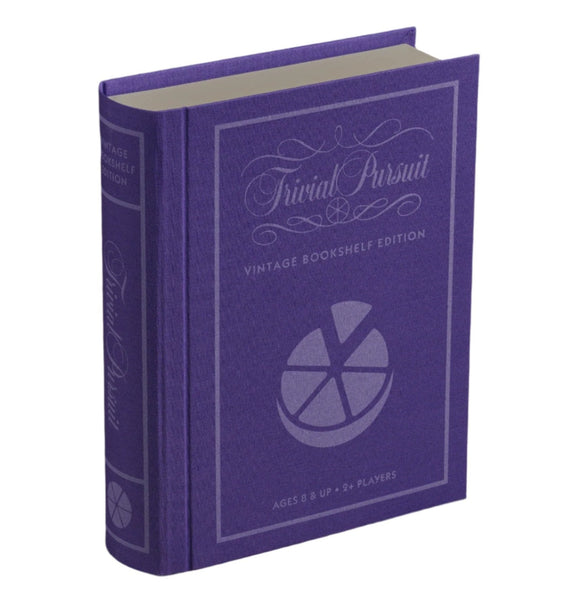 A purple, book-shaped box branded by WS Game Company showcases the "Trivial Pursuit Vintage Bookshelf Edition," featuring a cover with a pie chart design. This timeless trivia game is designed for players aged 8 and above and can be enjoyed by two or more participants.