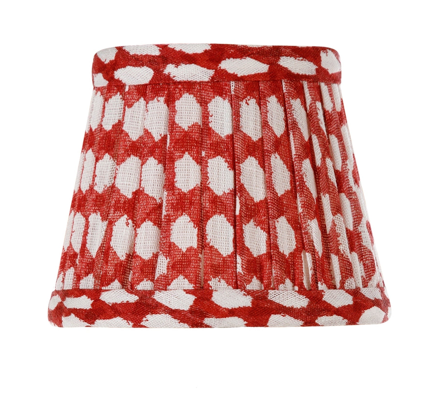 The Zafferano x Fermoie Poldina Lampshade Collection by Zafferano America features a handmade mini lampshade with a red and white polka dot pleated design on a plain white background.