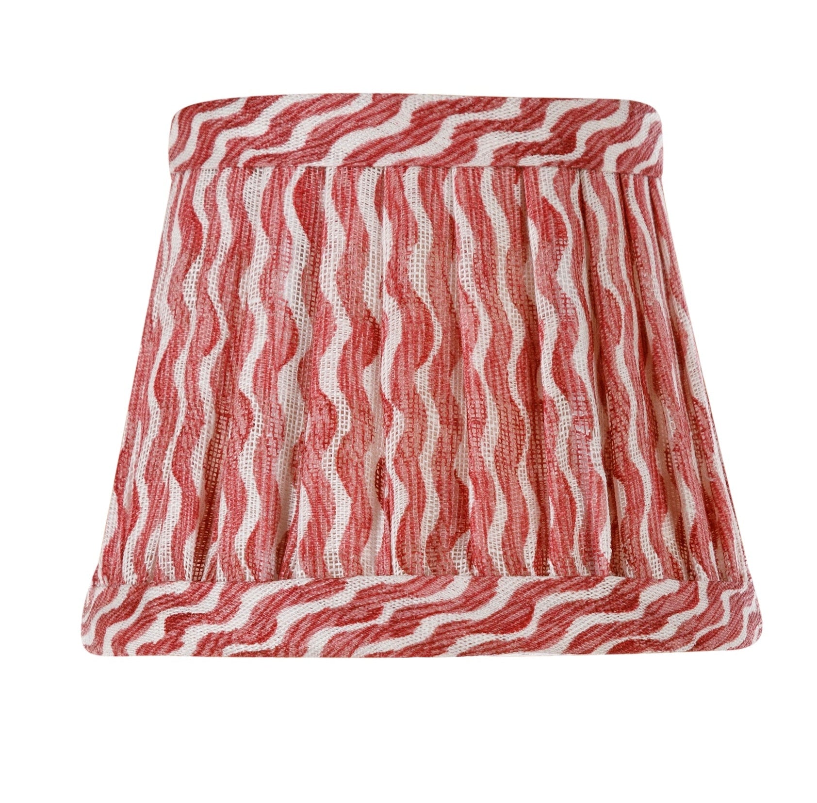 The Zafferano x Fermoie Poldina Lampshade Collection by Zafferano America features hand-made lampshades with red and white wavy stripes, adding a stylish accent to any room.