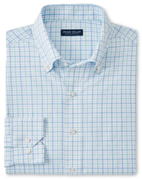 A neatly folded, light blue and white checkered Peter Millar Rollins Performance Poplin Sport Shirt with a button-down collar and buttoned cuffs features performance fabrication and UPF 50+ sun protection.