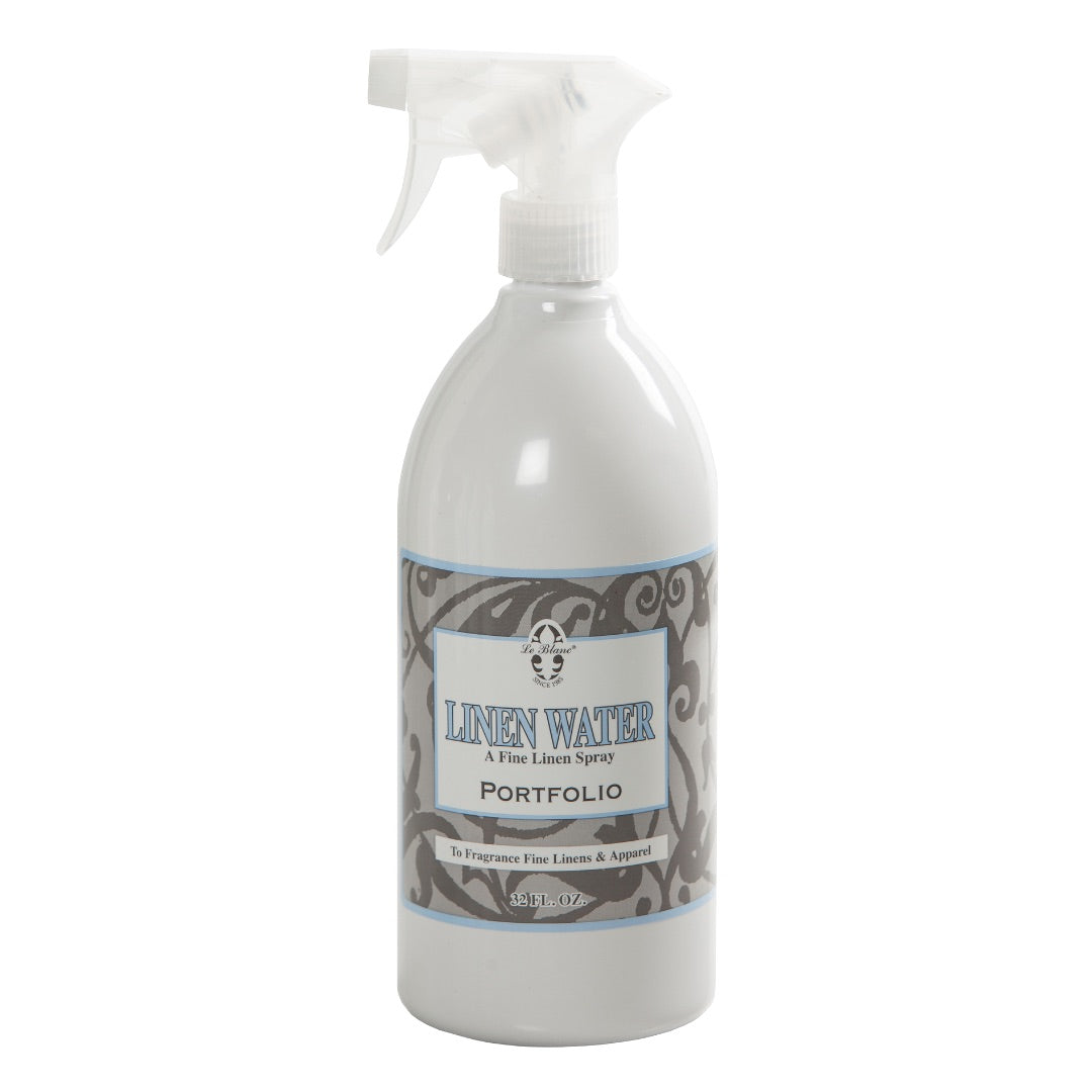 A spray bottle of Le Blanc Linen Water Spray featuring a decorative label—ideal for refreshing household linens with a clean, subtle fragrance.