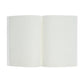 A Willa Amber Paper Journal by Juliska, featuring open blank white pages and a floral cover, photographed from above against a white background.