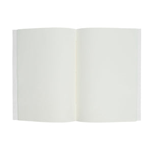 A Willa Amber Paper Journal by Juliska, featuring open blank white pages and a floral cover, photographed from above against a white background.
