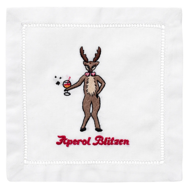 An embroidered reindeer with a cocktail embellishes this August Morgan Cocktail Napkin, titled "Aperol Blitzen," adding a playful touch.