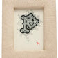 A decorative letter "P" in black ink on white paper is displayed in Pigeon & Poodle’s Ancona Frame Collection, featuring a textured, light-toned rectangular frame and accented with a small red animal at the bottom right for creative flair.