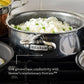 A Hestan NanoBond Covered Saucepan with cooked rice and peas sits on a stovetop. Its wider base ensures even heating and delivers 35% greater heat conductivity thanks to Hestan’s revolutionary ProCore™.