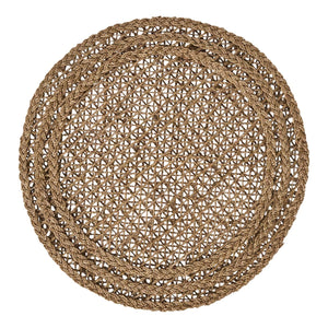 The Le Panier Placemat by Juliska is a round handwoven placemat crafted from natural fibers, featuring a lattice pattern with two braided borders, shown from above against a white background.