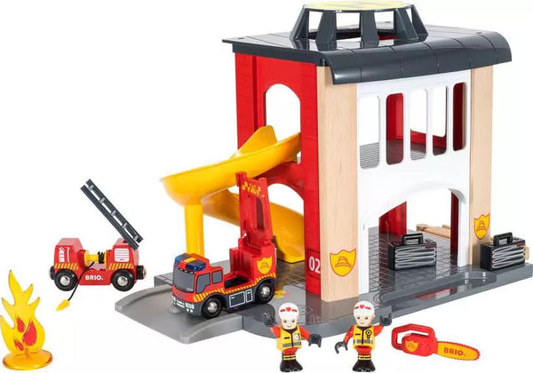 A BRIO World Fire Station toy available for order on the BRIO Online Shop, featuring fire trucks and a slide.