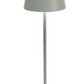The Poldina Pro Lamp Collection by Zafferano America features a modern, minimalist gray table lamp with a conical shade and square base—perfect for cordless illumination thanks to its rechargeable design.