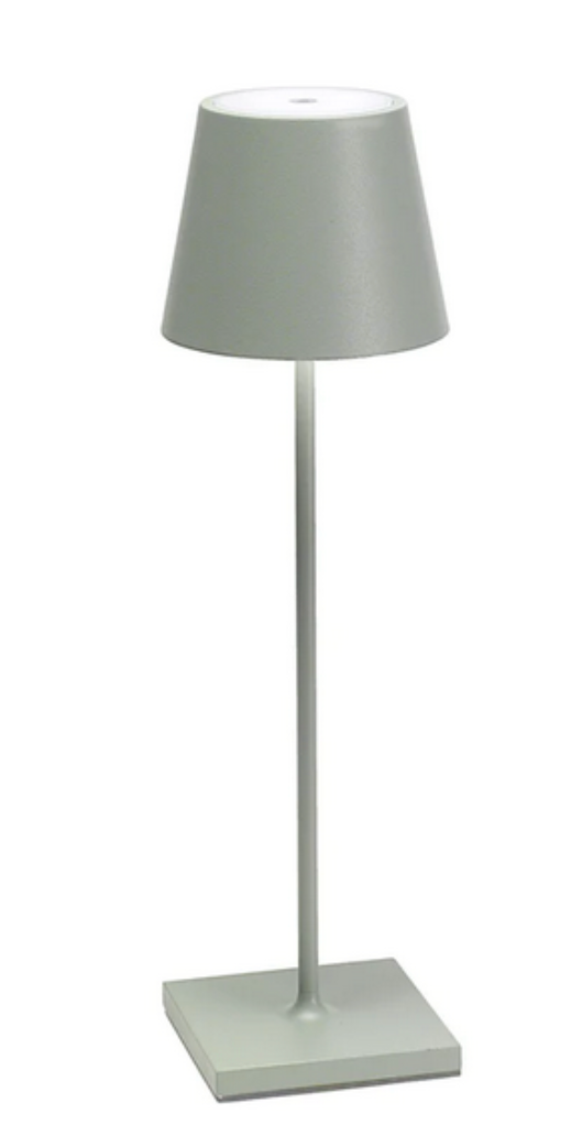 The Poldina Pro Lamp Collection by Zafferano America features a modern, minimalist gray table lamp with a conical shade and square base—perfect for cordless illumination thanks to its rechargeable design.