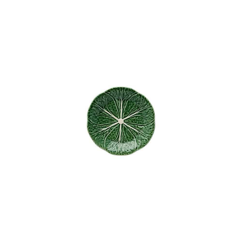 A round ceramic plate from the Green Cabbage Dinnerware Collection by Bordallo Pinheiro, featuring a green cabbage leaf design, is viewed from above against a white background.