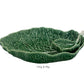 The HIVE Cabbage Leaf Green Collection features a handmade ceramic serving set—large platter, small bowl, and spoon—crafted in Portugal. Part of our Serveware Collection. Text below reads "Chip & Dip.