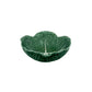 A bowl from the Green Cabbage Dinnerware Collection by Bordallo Pinheiro, crafted in Portugal and designed to resemble a cabbage leaf, is shown on a white background.
