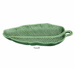 The HIVE Banana Leaves Platter Collection features a small green ceramic dish shaped like a leaf with detailed vein patterns, shown from a slightly angled view.